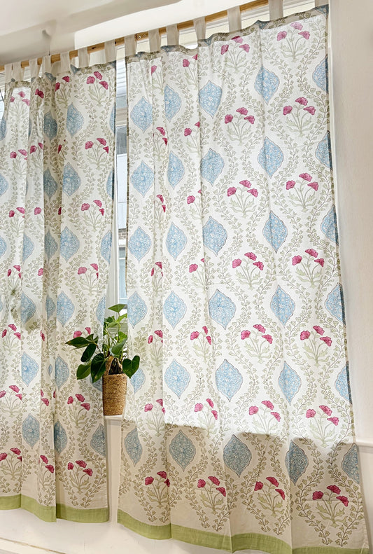 Stunning block-printed curtains on a crisp white cotton base with floral blue motif